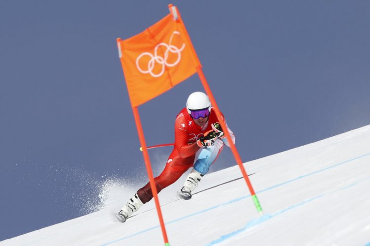 Beat Feuz wins Olympic downhill, completes career collection
